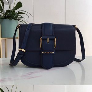 Brand new MK navy cross bag .